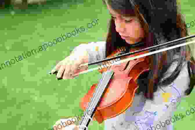 A Child Practicing The Violin With Repetition Beyond The Music Lesson: Habits Of Successful Suzuki Families