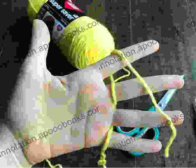 A Close Up Of A Crocheter's Hands Carefully Controlling The Tension Of The Yarn. How To Crochet: Beginner S Guide