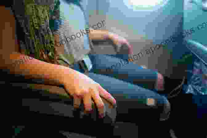 A Hand Gripping An Airplane Seat With Clouds In The Background, Symbolizing The Gripping Stories And Turbulence Of Life As A Flight Attendant. For Your Safety Please Hold On