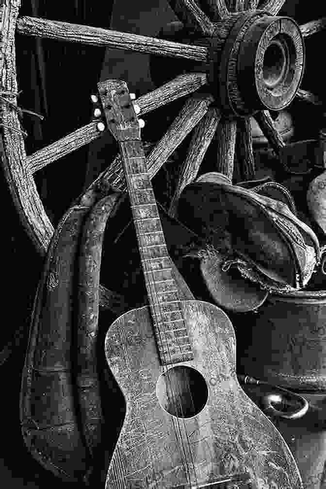 A Weathered Guitar And A Cracked Cowboy Hat, Symbolizing The Lessons Learned Through Life's Experiences The Little Of Country Music Wisdom