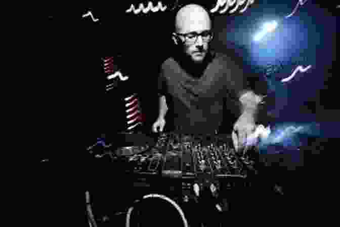 Moby Performing Live In Front Of A Celestial Backdrop, Symbolizing The Intersection Of Music And The Cosmos The Universe According To Moby